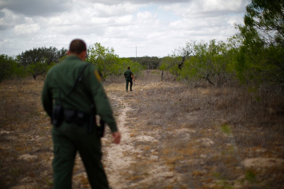 US border agents search for a group of 50 undocumented immigrants following a report from a rancher, near Falfurrias, Texas, March 29, 2013.