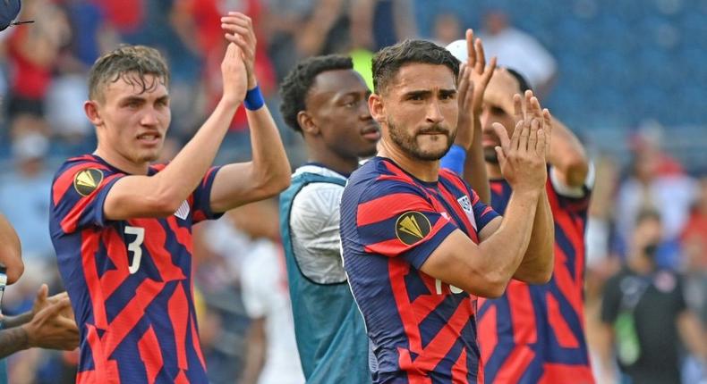 United States players hope to celebrate again after the semi-finals of the CONCACAF Gold Cup football tournament Creator: Peter Aiken