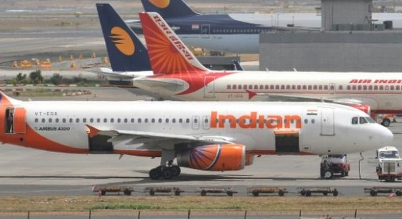 A politician has admitted hitting an air steward on an Air India flight with a slipper 25 times