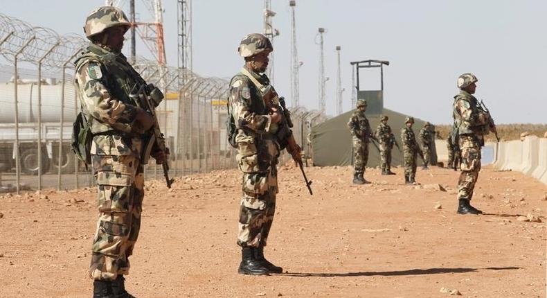 Algerian soldiers are seen at the Tiguentourine Gas Plant in In Amenas, 1600 km (994 miles) southeast of Algiers, January 31, 2013. REUTERS/Louafi Larbi