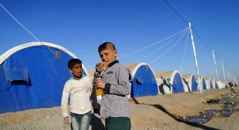 Iraqi refugees pictured at the Khazir refugee camp near the Kurdish checkpoint of Aski Kalak, 40 km west of Arbil, the capital of the autonomous Kurdish region of northern Iraq, on November 21, 2016