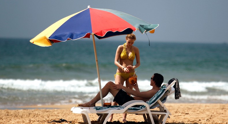 Tourists on a beach in Sri Lanka.REUTERS/Dinuka Liyanawatte