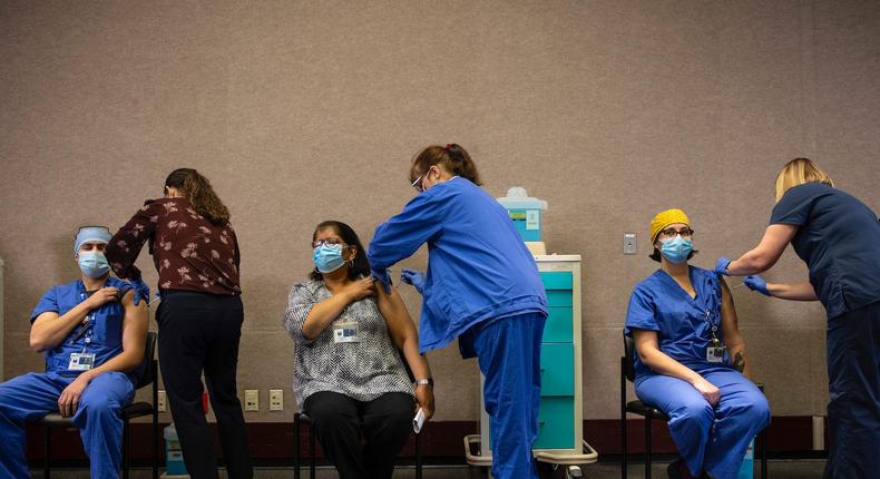 Healthcare workers get the Pfizer-BioNTech COVID-19 vaccination at the Legacy Emanuel Medical Center on December 16, 2020 in Portland, Oregon.