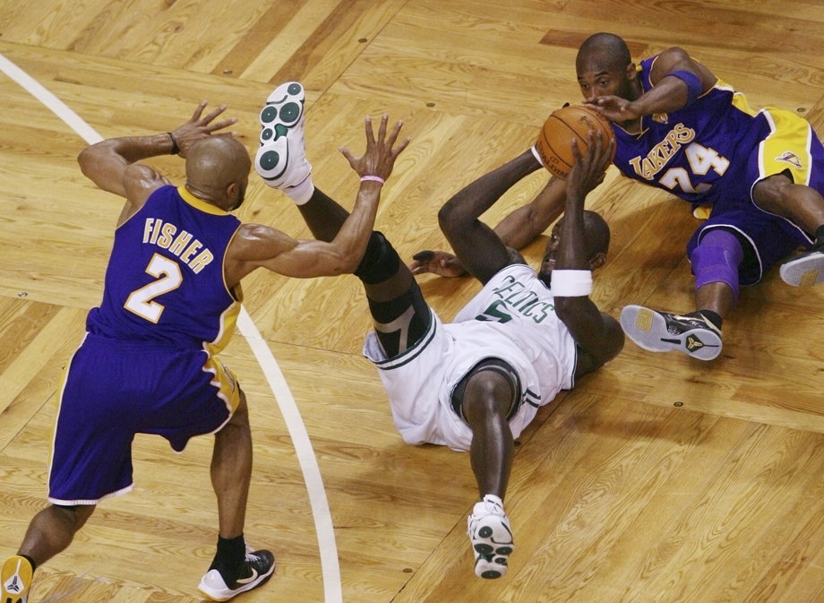Bryant dives for a loose ball while playing the Boston Celtics in the 2010 NBA Finals. The Lakers would go on to win the series, and Bryant was once again awarded the Finals MVP trophy.