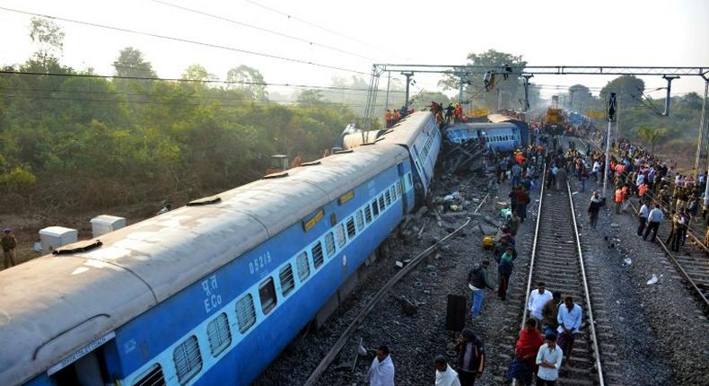 Rescue workers search for victims at the site of the derailment of the Jagdalpur-Bhubaneswar express train near Kuneru station in Andhra Pradesh state, southern India on January 22, 2017