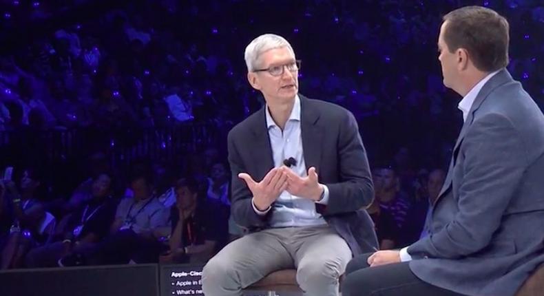 Apple CEO Tim Cook (left ) and Cisco CEO Chuck Robbins talk about make Apple devices work better at work.