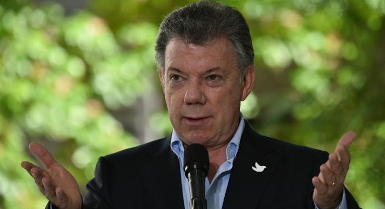 With the laying down of arms ... the conflict is truly over and a new phase begins in the life of our nation, Colombian President Juan Manuel Santos said