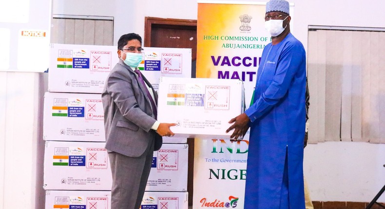 Chairman of the Presidential Task Force (PTF) on COVID-19 and Secretary to the Government of the Federation, Boss Mustapha receives the 100,000 doses of Covishield Vaccines from the Indian High Commissioner to Nigeria, Mr Velagaleti Surendra. [Twitter/@NphcdaNG]