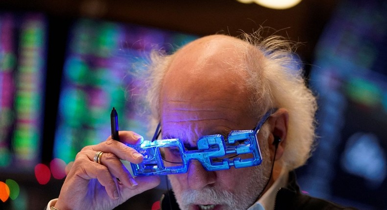 Stock trader Peter Tuchman looks at a clipboard on the floor of the New York Stock Exchange at the closing bell on December 30, 2022 in New York.Timothy A. Clary/Getty Images