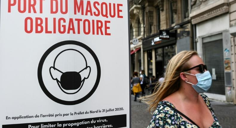 A sign warns passersby that masks are mandatory in Lille, northern France in August 2020