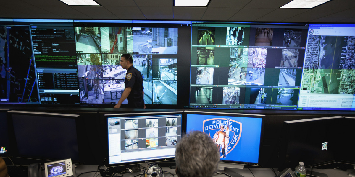 A New York Police Department officer watches video feeds in the Lower Manhattan Security Initiative facility in New York September 1, 2011.