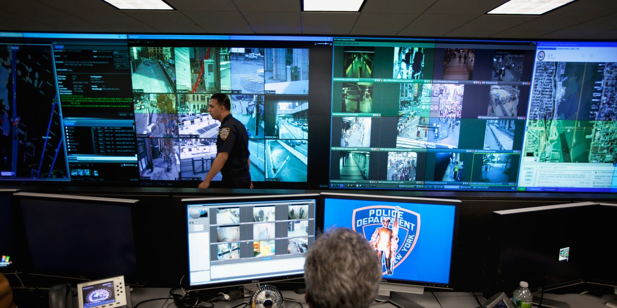 A New York Police Department officer watches video feeds in the Lower Manhattan Security Initiative facility in New York September 1, 2011.