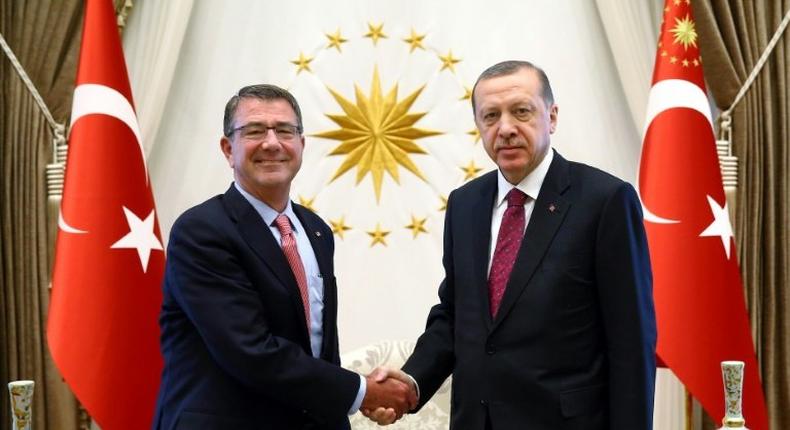 Turkish President Recep Tayyip Erdogan (right) shaking hands with US Secretary of Defence Ashton Carter before a meeting in Ankara, on October 21, 2016