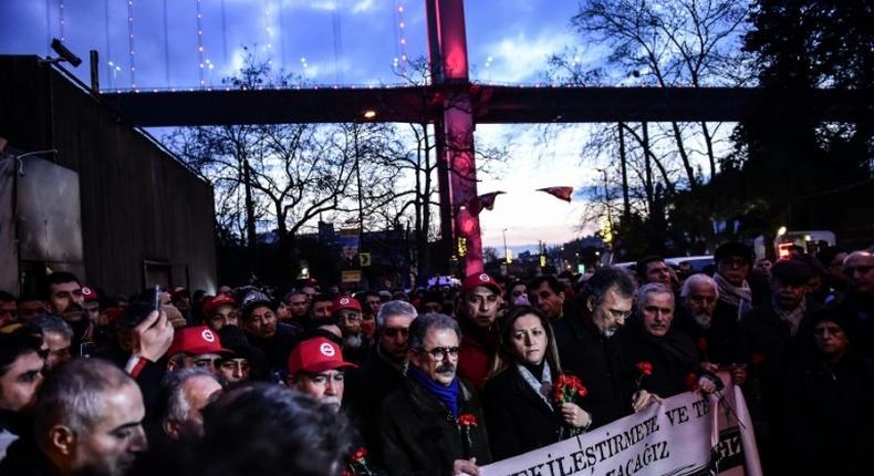 Turkish union members hold a banner that reads, We will not get used to Terrorism as they gather in front of the Reina nightclub on January 3, 2017 in Istanbul days after a gunman killed 39 people during New Year celebrations