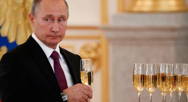 Russia's President Vladimir Putin holds a glass during a ceremony of receiving diplomatic credentials from foreign ambassadors at the Kremlin in Moscow, Russia.Reuters/Sergei Karpukhin