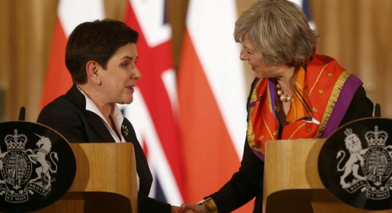 British Prime Minister Theresa May (R) and Polish Prime Minister Beata Szydlo give a joint press conference following their meeting at 10 Downing Street in central London on November 28, 2016