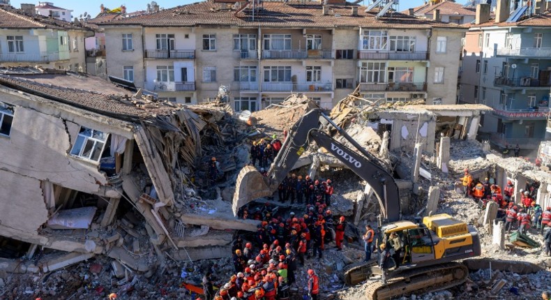 Nearly 4,000 rescue workers combed through debris in freezing temperatures, helped by mechanical diggers, in vain hopes of finding anyone alive