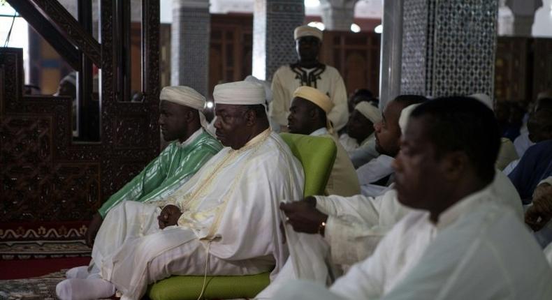 Incumbent Gabonese President Ali Bongo Ondimba attends prayers at the Assan II Mosque in Libreville on September 12, 2016