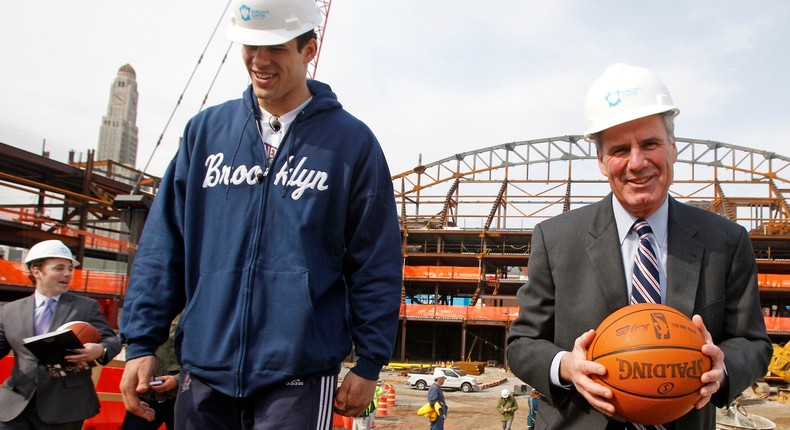 New Jersey Nets forward Kris Humphries, left, and Nets Executive Vice President Leo Ehrline leave the site of the Barclays Center under construction near downtown Brooklyn in New York, Monday, April 4, 2011.