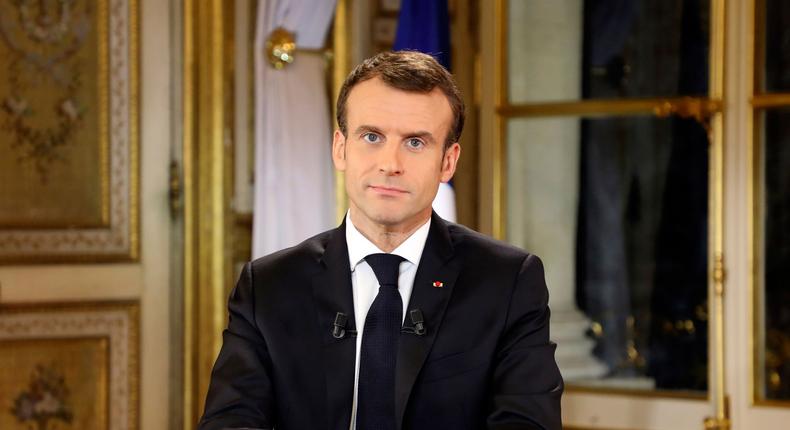 French President Emmanuel Macron poses before a special address to the nation, his first public comments after four weeks of nationwide 'yellow vest' protests, at the Elysee Palace, in Paris, Monday, Dec. 10, 2018. Facing exceptional protests, French President Emmanuel Macron is promising to speed up tax relief for struggling workers and to scrap a tax hike for retirees.