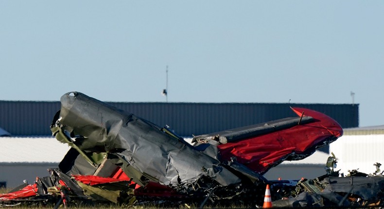 Debris from two planes that crashed during an airshow at Dallas Executive Airport are shown in Dallas on Saturday, Nov. 12, 2022.LM Otero/AP