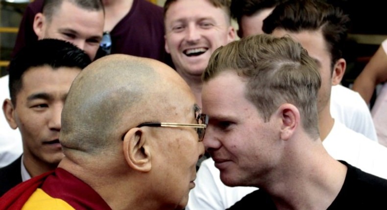 The Dalai Lama (left) greets Australian Test captain Steve Smith in Dharamsala, India, on March 24, 2017