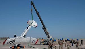 Airmen used airbags, forklifts, and cranes to invert an aircraft that flipped during a thunderstorm with wind gusts of up to 54 mph.US Air Force photo by Airman 1st Class Gavin Hameed