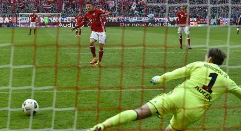 Bayern Munich's striker Robert Lewandowski scores a penalty during the German first division Bundesliga football match against Hamburg SV February 25, 2017