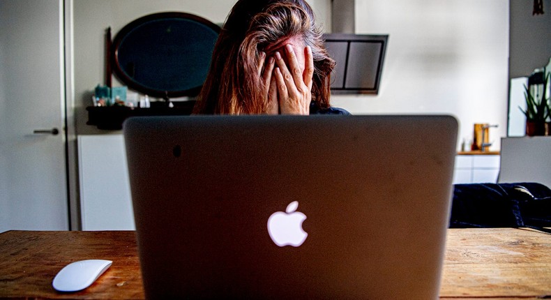 A woman on her laptop appears to be stressed during the coronavirus pandemic on May 30, 2020 in Rotterdam, the Netherlands. The woman is not associated with the story.