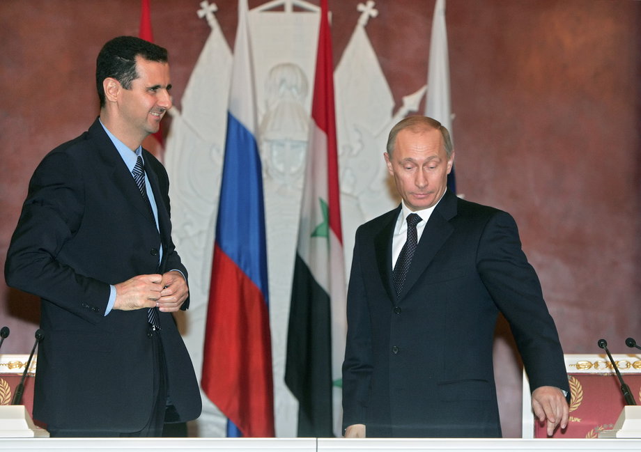 Syrian President Bashar Assad and Russian President Vladimir Putin prepare for statements after a signing ceremony at the Kremlin.