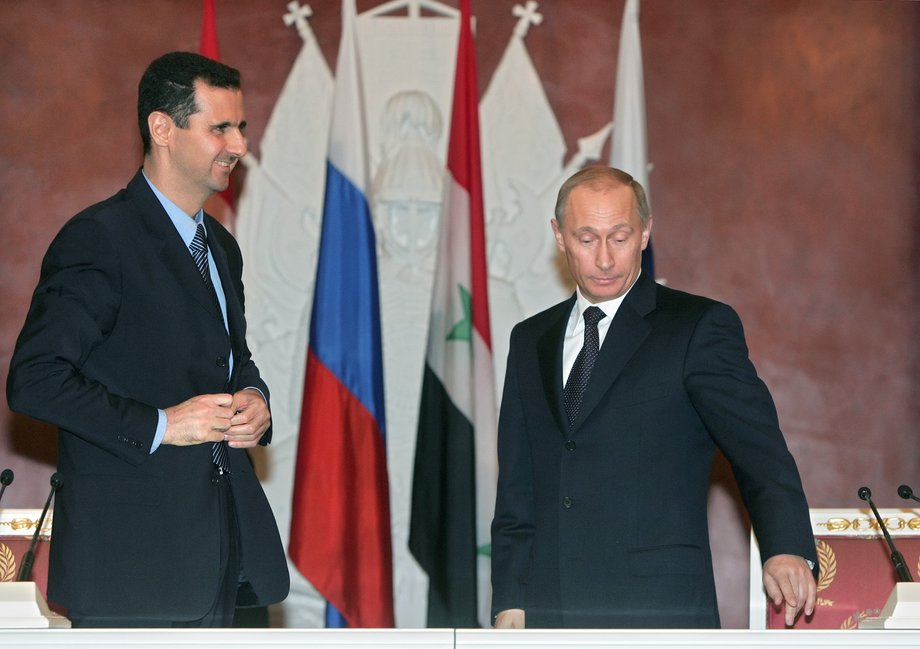 Syrian President Bashar Assad and Russian President Vladimir Putin prepare for statements after a signing ceremony at the Kremlin.