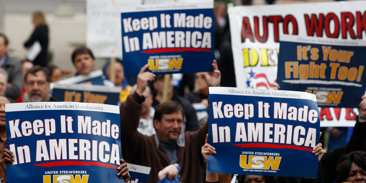 People participate in a labor activists' march in Lansing, Michigan, June 1, 2009. For decades, unionized manufacturing jobs have been considered the surest path to middle-class prosperity and realizing the vaunted American dream for blue-collar workers.