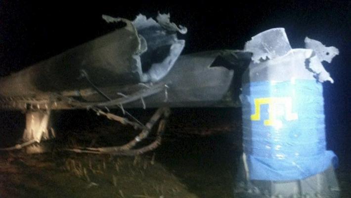 A view shows a damaged pylon in Kherson region, Ukraine, in this still image taken from footage shot