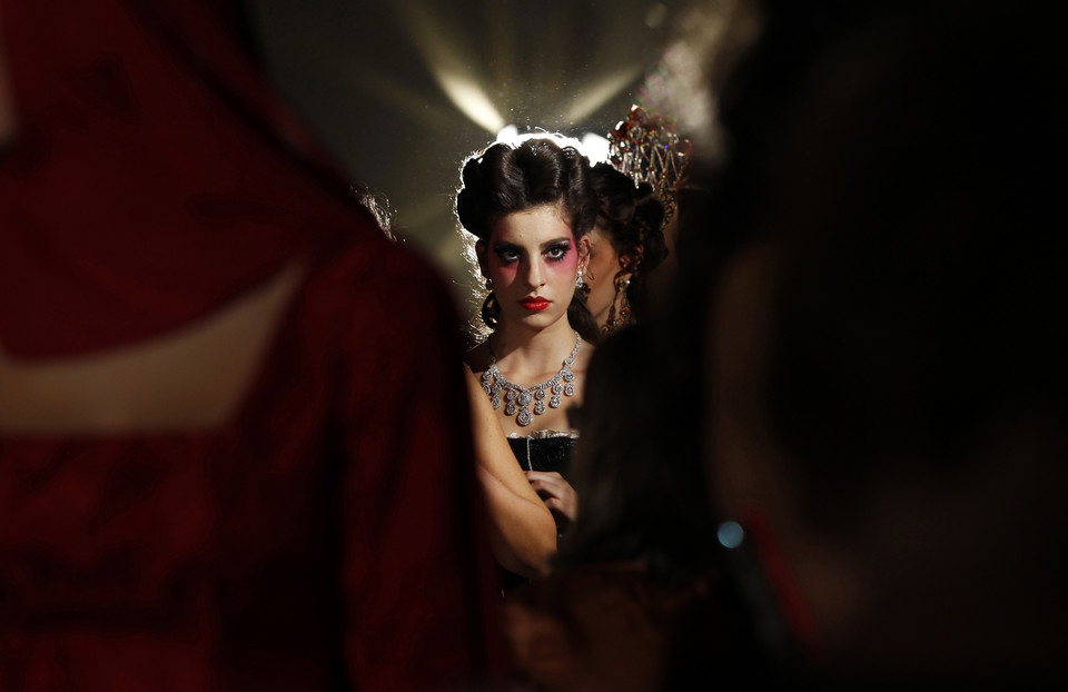 A model is seen backstage before the start of the Sevilla Fashion Show in the Andalusian capital of Seville October 18, 2010.