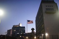 FILE PHOTO: A vintage car passes by in front of the U.S. Embassy in Havana, Cuba