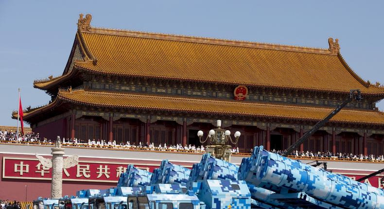 Military vehicles carry DF-10 ship-launched cruise missiles as they travel past Tiananmen Gate during a military parade to commemorate the 70th anniversary of the end of World War II in Beijing Thursday Sept. 3, 2015.