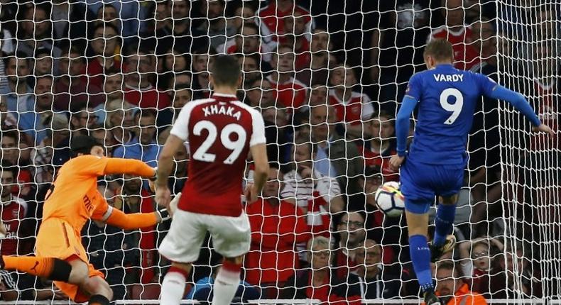 Leicester City's English striker Jamie Vardy (R) scores his side's second goal past Arsenal's Czech goalkeeper Petr Cech during the English Premier League match at the Emirates Stadium in London on August 11, 2017