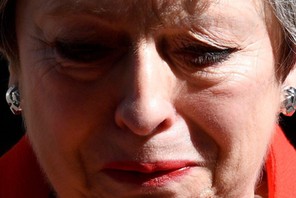 British Prime Minister Theresa May reacts as she delivers a statement in London