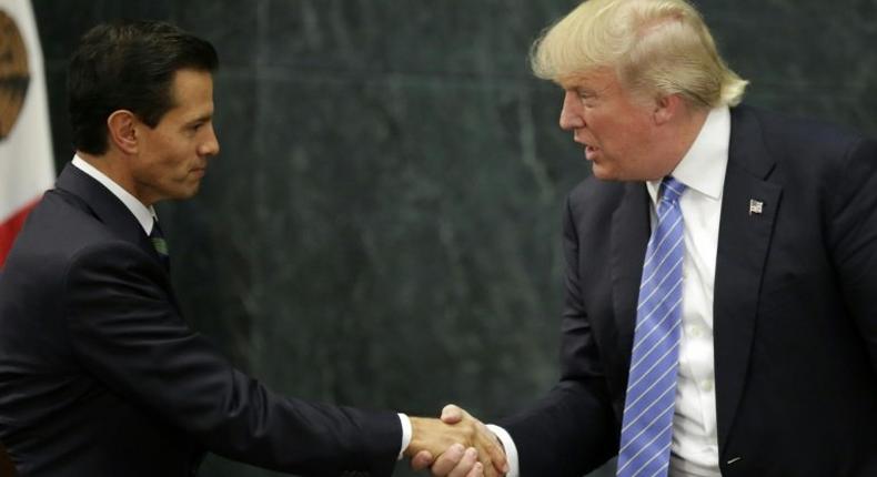 Mexican President Enrique Pena Nieto (left) held talks with Donald Trump after talks in Mexico City on August 31, 2016