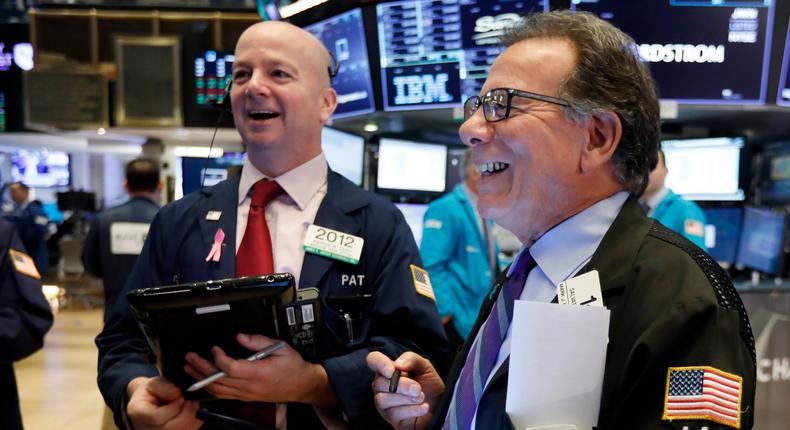 FILE- In this Feb. 15, 2019, file photo traders Patrick Casey, left, and Sal Suarino work on the floor of the New York Stock Exchange. The U.S. stock market opens at 9:30 a.m. EST on Wednesday, Feb. 27. (AP Photo/Richard Drew, File)