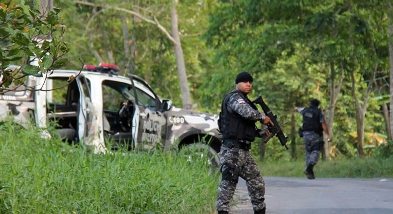 Military police officers track fugitives of the Anisio Jobim Penitentiary Complex after a riot in the prison on January 2, 2017