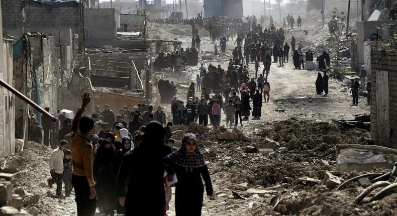 In war-torn west Mosul, seized this week by Iraqi forces, hundreds of residents finally received food aid