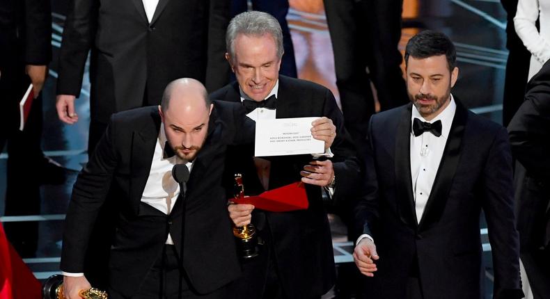 La La Land producer Jordan Horowitz (L) showing the correct best-picture winner, Moonlight.