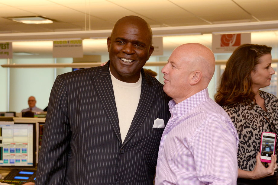 Former football star Lawrence Taylor with BTIG's Starker.