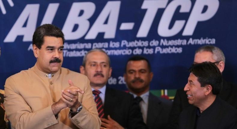 The US has imposed a few new rounds of sanctions over efforts by Venezuelan President Nicolas Maduro (L) to install an all-powerful new Constituent Assembly