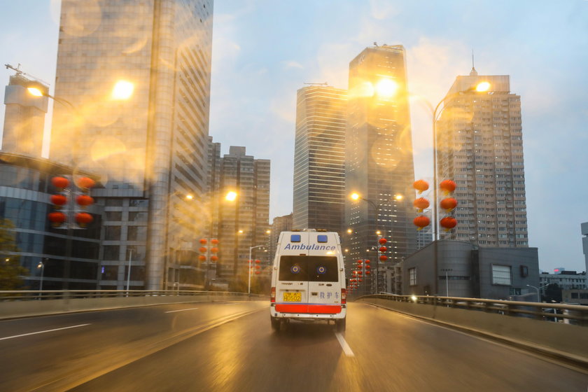 China: Wuhan coronavirus emergency. An ambulance runs on the empty roads in Wuhan