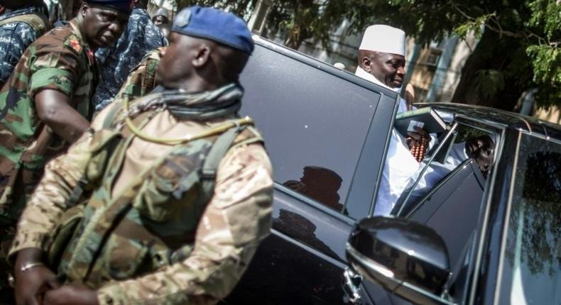 Incumbent Gambian president Yahya Jammeh gets back into his armoured car after casting his marble at a polling station in Banjul on December 1, 2016