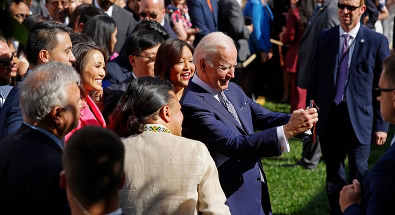 President Joe Biden uses a White House guest's phone to take a selfie.Chip Somodevilla/Getty Images
