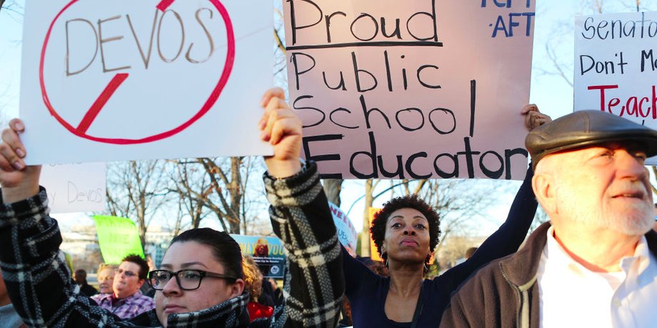 Protesters demonstrate against DeVos, President Donald Trump's nominee for secretary of education, on Monday in Washington, DC.