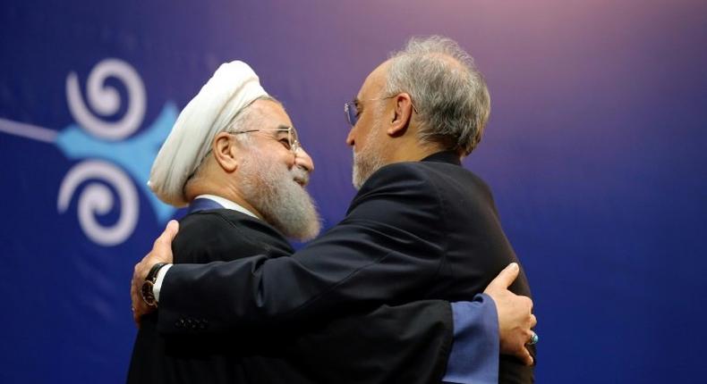 Iranian President Hassan Rouhani (L) made a 2015 nuclear deal with world powers the centrepiece of his first term. Here he awards atomic energy chief Ali Akbar Salehi the medal of honour on February 8, 2016